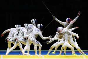 RIO DE JANEIRO, BRAZIL - AUGUST 07: (Editors Note: Image was created using multiple exposure) Alexander Massialas of the United States defeats Artur Akhmatkhuzin of Russia during Men's Individual Foil Round of 16 on Day 2 of the Rio 2016 Olympic Games at Carioca Arena 3 on August 7, 2016 in Rio de Janeiro, Brazil. (Photo by Alex Livesey/Getty Images)